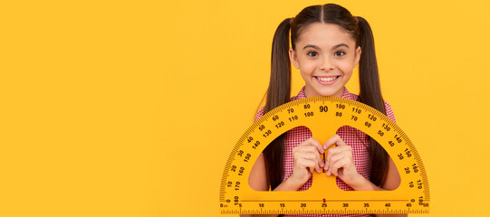 Wall Mural - happy teen girl hold school math tool protractor ruler on yellow background, geometry. Banner of schoolgirl student. School child pupil portrait with copy space.