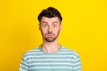 Poster - Photo of impressed guy look wear striped t-shirt isolated on yellow color background