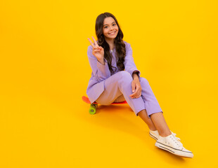 Poster - Elegant fashion teenager child girl posing in studio. Trends kids clothes. Mock up copy space.