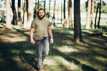 Handsome man portrait in forest