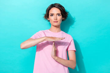 Poster - Photo of calm focused lady arm palm demonstrate timeout symbol isolated on aquamarine color background