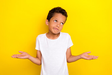 Sticker - Photo of cute stylish boy arm shoulder raise dont know homework oops sorry look empty space isolated on yellow color background