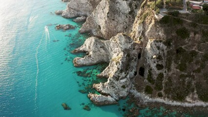 Wall Mural - Cliff on the turquoise sea in summer blue colors