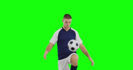 Poster - Video of caucasian male soccer player kicking ball on green screen background