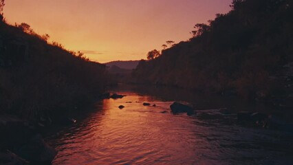 Wall Mural - River in mountains. Clean rapid river flowing in Brazilian mountains at sunset