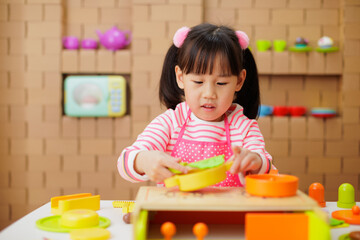 Sticker - young girl pretend playing food preparing at home