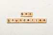 © sosiukin - set boundaries word written on wood block. set boundaries text on table, concept