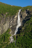 Fototapeta  - Geiranger Fjord in Norway with waterfalls cascading down the high mountains.