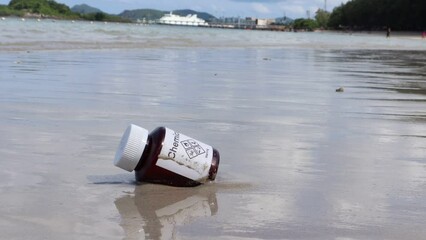 Poster - Chemical bottles from the lab were discarded on the beach and destroy the environment