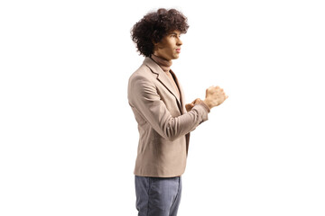 Sticker - Profile shot of a young elegant man with a curly hair posing