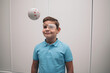 ©  Yistocking - A child undergoes vision therapy in an optician. Marsden ball.