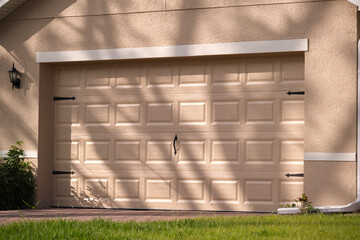 Wall Mural - Wide garage double door and concrete driveway of new modern american house