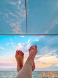 bare feet against the summer sky