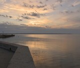 Fototapeta Pomosty - Walk at dawn along the embankment of the city of Kerch, Russia, seascape of a summer morning, the concept of travel and recreation.