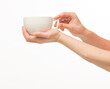 © serhii - female hands hold a white cup on a white background isolated