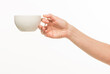 © serhii - female hands hold a white cup on a white background isolated