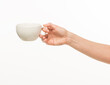 © serhii - female hands hold a white cup on a white background isolated