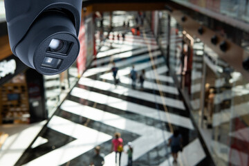 CCTV security camera on blur people in food center or shopping mall.