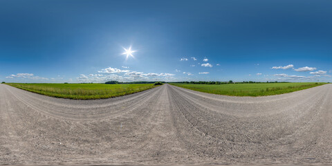 Wall Mural - 360 hdri panorama on no traffic gravel dusty white sand road among fields with fluffy clouds in full