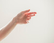 © serhii - female hand shows gestures on a white background isolated.number direction fist approval