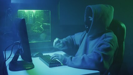 Cybercriminal hacker typing and rejoicing. High quality 4k footage