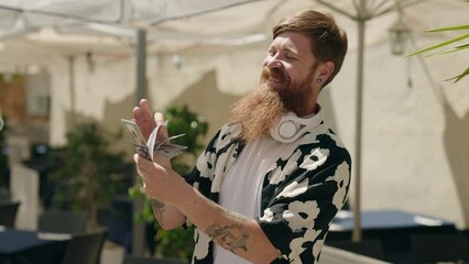 Sticker - Young redhead man smiling confident counting dollars at street