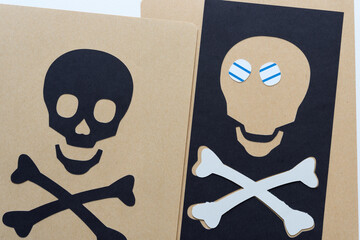 Poster - set of fun paper skull and crossbones on brown, black, and white paper