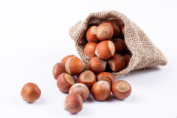 Wall Mural - Shelled hazelnuts on the white background
