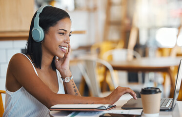 Sticker - Happy student relaxing, studying or searching online videos on her laptop at a coffee shop with free internet. Young woman at a cafe store listening to music, radio or podcast news entertainment