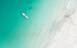 Top view of Speed Boat for tourist surrounding by blue aqua sea water and white sand beach. Capture by drone. 