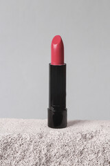 Wall Mural - Natural cosmetic. Beauty products. Lipstick tube on stone podium, gray background. Product photo. Abstract composition. Natural showcase