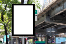 Outdoor Pole Billboard With Mock Up White Screen On Footpath And Clipping Path