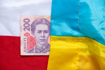 Wall Mural - The flag of Ukraine and Poland and two hundred hryvnias between them, 200 hryvnias on the flag of Ukraine and Poland, the economy