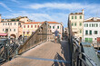 Wooden footbridge across water canal in Chioggia