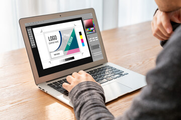 Graphic designer software for modern design of web page and commercial ads showing on the computer screen