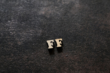 Wall Mural - the letters f and f above the dark field. initials ff