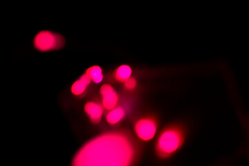 bright red light spots on black background. overlay, sparkle, wallpaper, copy space...