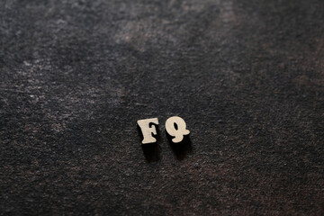 Wall Mural - The letters F and Q above the dark field. Initials FQ