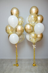 Wall Mural - golden and white balloons with helium, decoration of the holiday with balloons, balloon photo zone