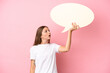 © luismolinero - Young Lithuanian woman isolated on pink background holding an empty speech bubble