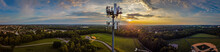 Panorama Of Mobile Cell Phone Transmission Tower On The Hill Of A Park In The Mid West City Of Lexington, KY During Dramatic Sunrise.