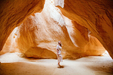 Young woman in cave