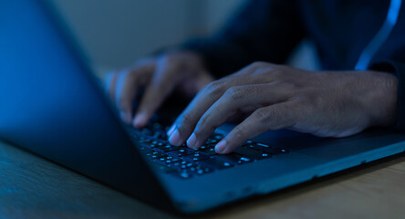 Wall Mural - Close up businessman hand typing or working on laptop for programming about cyber security , advance future technology concept