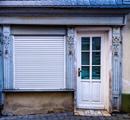 Poster - old store front at a street