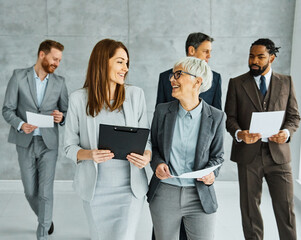 Poster - young business people meeting office teamwork group success corporate senior mature colleague together partner lobby