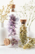 Dried herbal flowers with bottle. Homeopathy background.