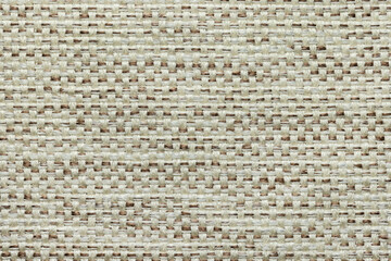 a fragment of a woven rug made of threads, as a background or texture, close-up.