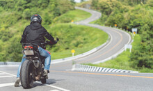 Man Driving A Motorcycle On A Beautiful Road Riding Have Fun Riding A Motorbike On The Expressway. With Copy Space