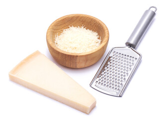 Wall Mural - Piece of parmesan cheese, knife and grated cheese in wooden bowl isolated on white background