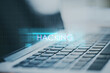 © Who is Danny - Close up of laptop with creative digital text hologram on blurry background. Hacking, technology and ai concept.